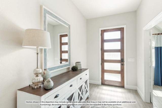 entryway with light hardwood / wood-style floors