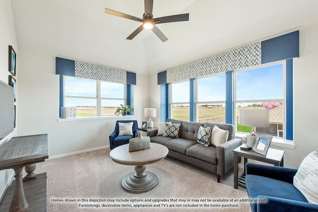 living room featuring a healthy amount of sunlight, carpet floors, and ceiling fan