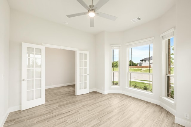 837 Rusty Run Dr, Midlothian, TX 76065 - unfurnished room featuring french doors, light wood-type flooring, baseboards, and a ceiling fan