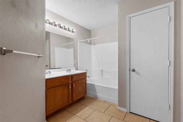 bathroom featuring vanity, shower / tub combination, tile patterned floors, and a textured ceiling