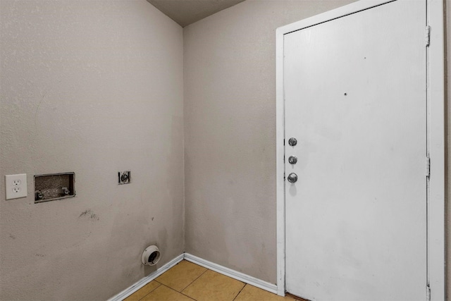 laundry area featuring washer hookup, light tile patterned floors, and electric dryer hookup