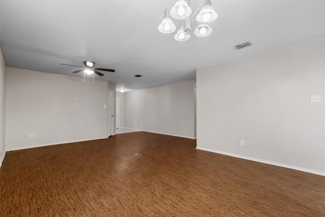 unfurnished room featuring dark hardwood / wood-style floors, ceiling fan with notable chandelier, and a textured ceiling