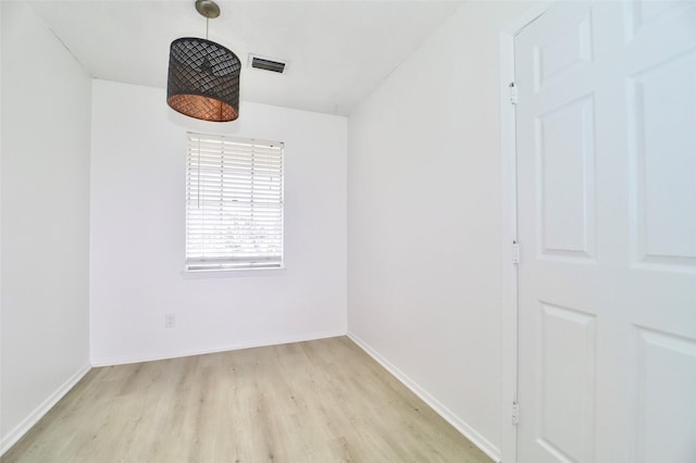 unfurnished room with light wood-type flooring