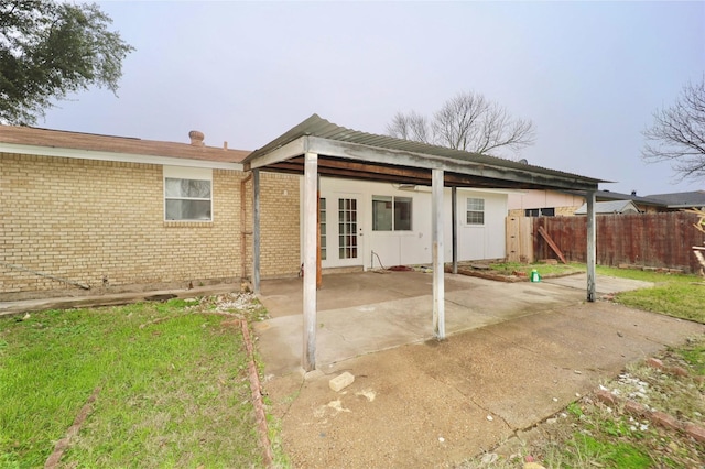 back of property with french doors and a patio