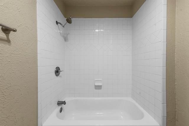 bathroom with shower / tub combination