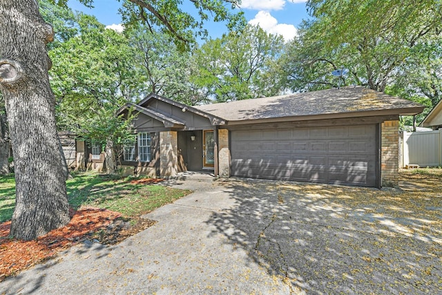 single story home featuring a garage