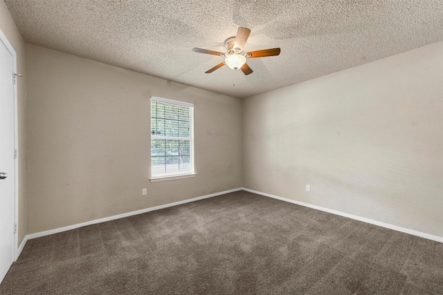 carpeted spare room featuring a textured ceiling and ceiling fan