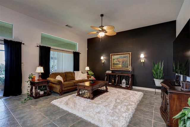 tiled living room featuring ceiling fan