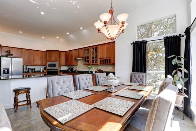 9801 Georgia Ave, Denton, TX 76207 - dining space with a chandelier, vaulted ceiling, and recessed lighting