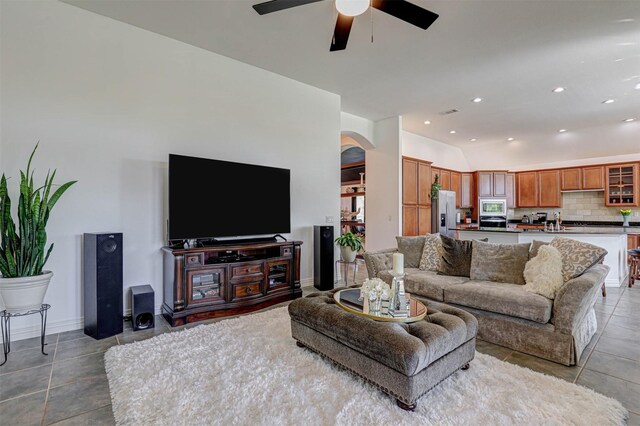 9801 Georgia Ave, Denton, TX 76207 - living room featuring a ceiling fan, arched walkways, light tile patterned floors, vaulted ceiling, and recessed lighting