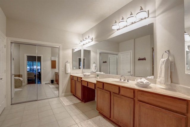 bathroom with tile patterned floors and vanity