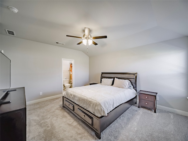 carpeted bedroom featuring ensuite bathroom, lofted ceiling, and ceiling fan