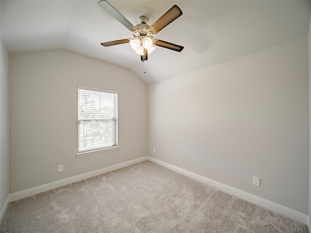 unfurnished room with lofted ceiling, light colored carpet, and ceiling fan