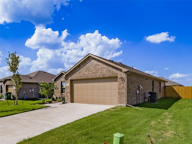 ranch-style home featuring a garage and a front lawn