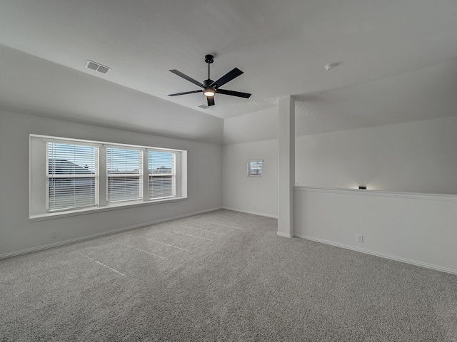 additional living space with ceiling fan, lofted ceiling, and light carpet