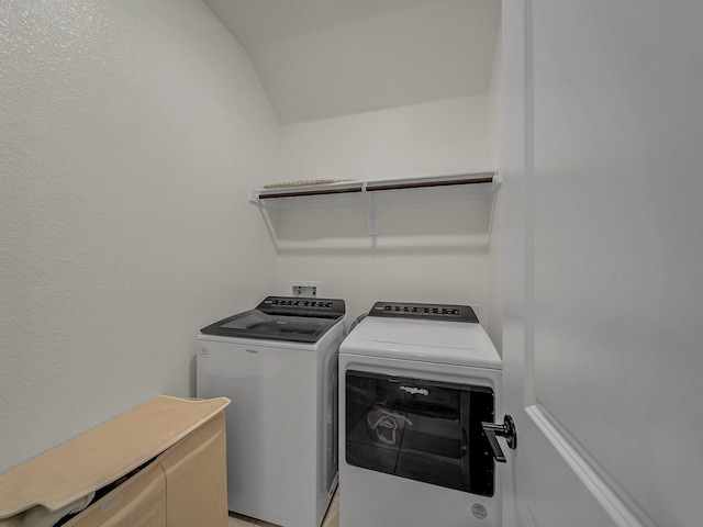 laundry room with washing machine and dryer