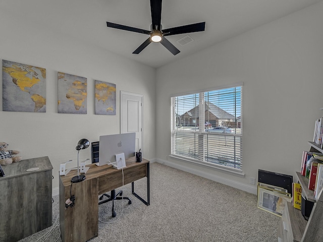 carpeted home office with ceiling fan