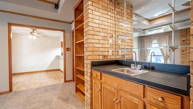 kitchen with ceiling fan, sink, and light carpet