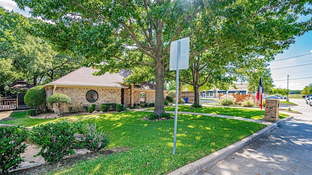 view of front of property with a front lawn