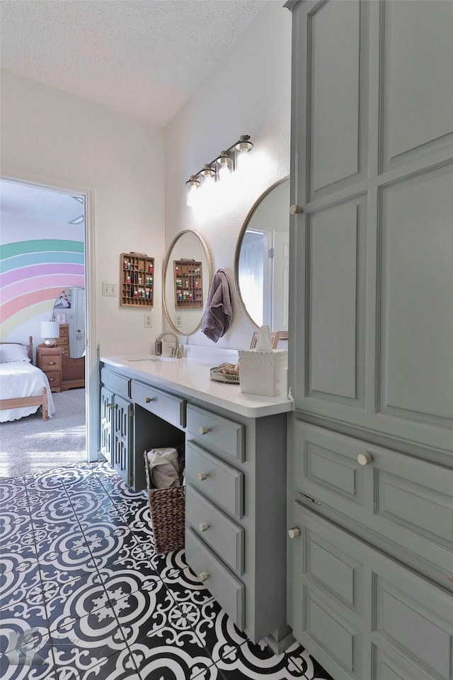 bathroom featuring vanity and a textured ceiling