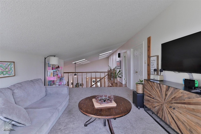 carpeted living room with a textured ceiling