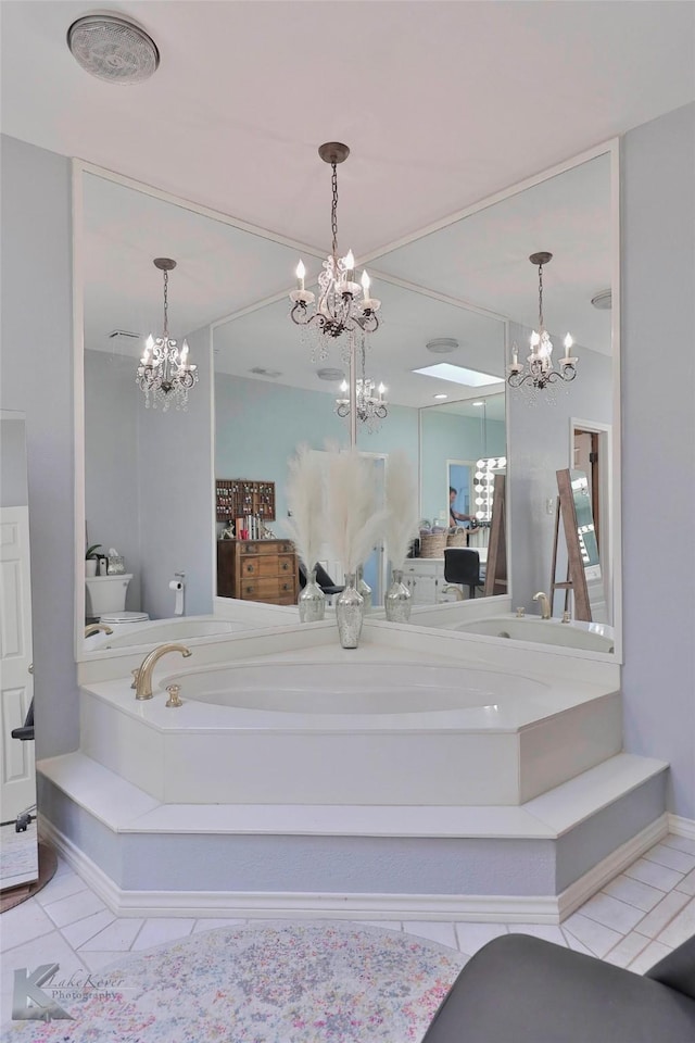 bathroom with tile patterned flooring, toilet, and a bathing tub