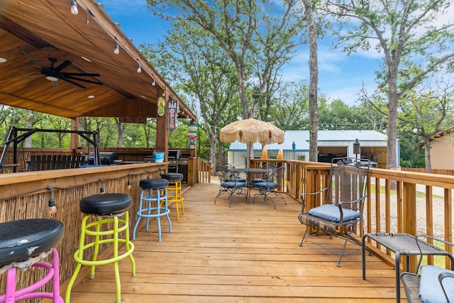 86593 N State Highway 289, Pottsboro, TX 75076 - wooden terrace with ceiling fan, exterior bar, and area for grilling
