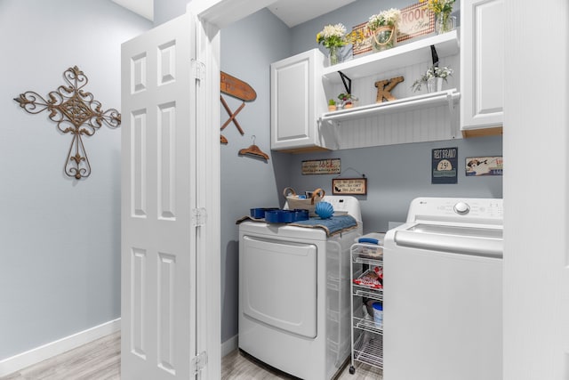 86593 N State Highway 289, Pottsboro, TX 75076 - washroom featuring cabinets, washing machine and clothes dryer, and light hardwood / wood-style floors