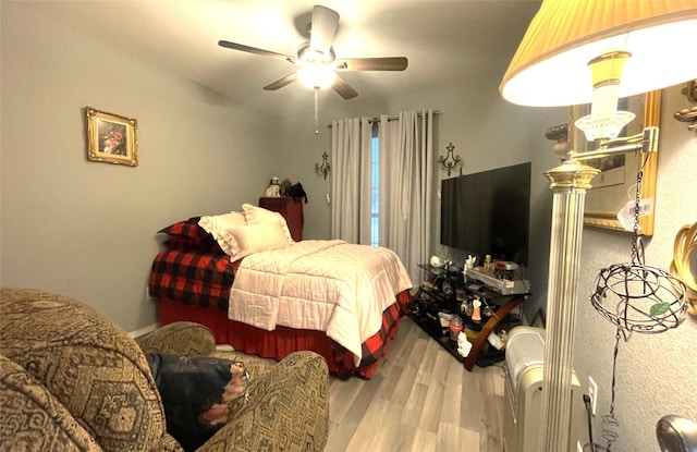 bedroom with hardwood / wood-style flooring and ceiling fan