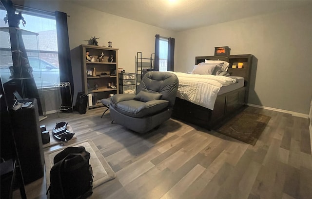 bedroom with hardwood / wood-style flooring