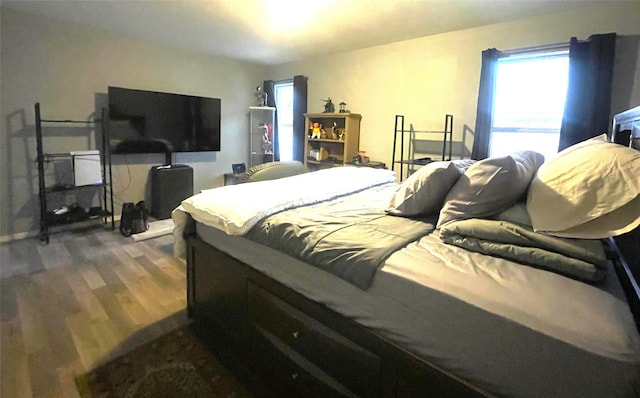 bedroom featuring dark hardwood / wood-style flooring