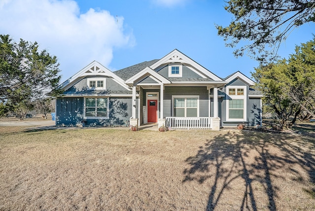 view of front of house featuring a porch and a front lawn