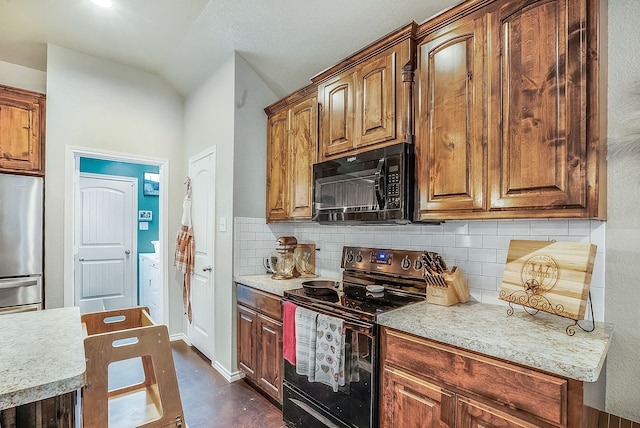 kitchen featuring decorative backsplash and black appliances