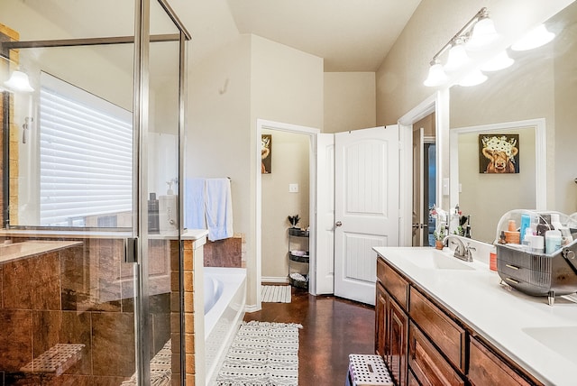 bathroom with vanity and separate shower and tub