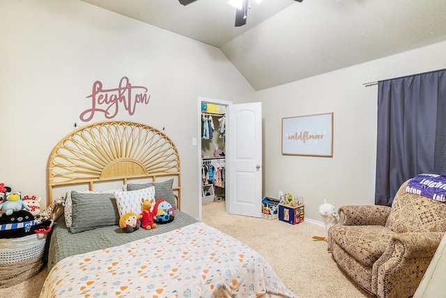 bedroom featuring ceiling fan, vaulted ceiling, carpet floors, a walk in closet, and a closet