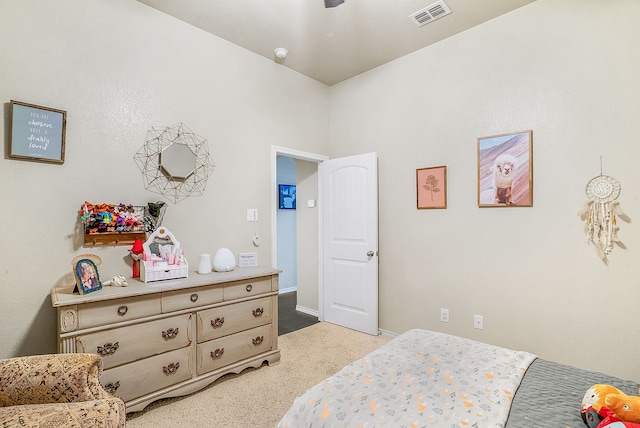 bedroom featuring light carpet