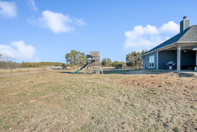 view of yard with a playground