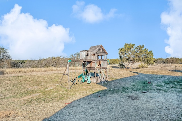 view of jungle gym with a lawn