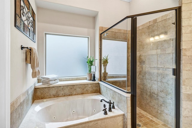 bathroom featuring separate shower and tub