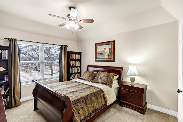 bedroom with multiple windows, light carpet, and ceiling fan