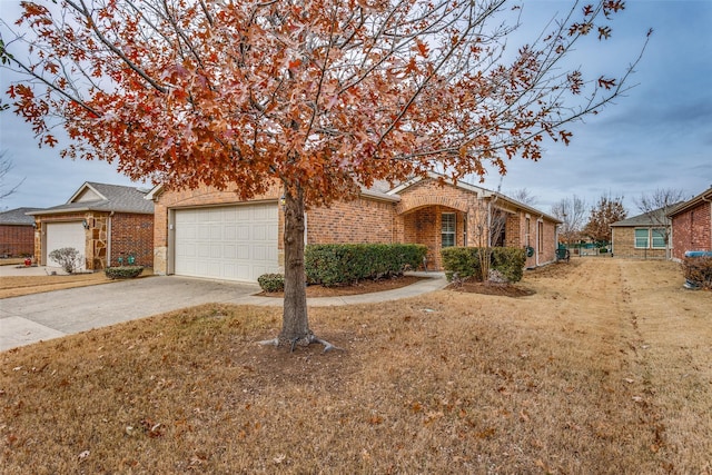 single story home with a garage and a front lawn