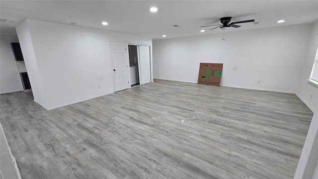 unfurnished room featuring ceiling fan and light hardwood / wood-style flooring