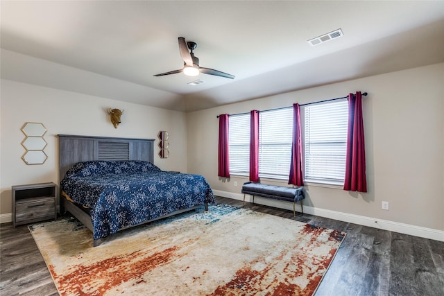 bedroom with lofted ceiling, dark wood-type flooring, and ceiling fan