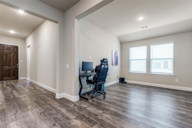 home office with dark hardwood / wood-style floors