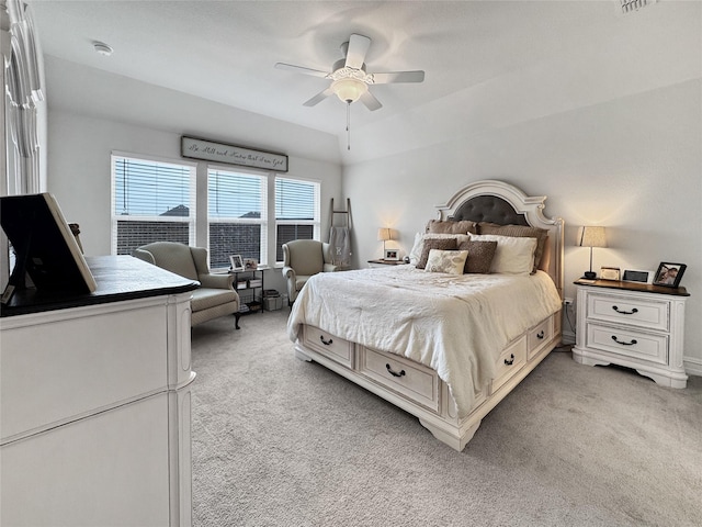 bedroom featuring light carpet and ceiling fan