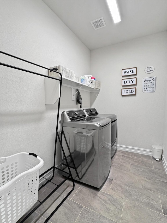 laundry room featuring washer and clothes dryer