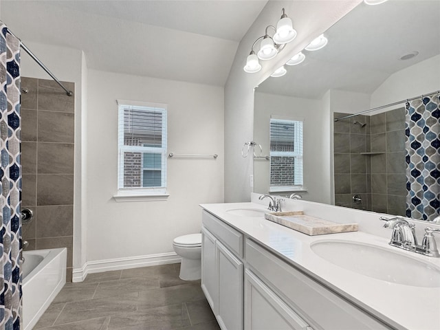 full bathroom with vanity, lofted ceiling, shower / bath combination with curtain, and toilet