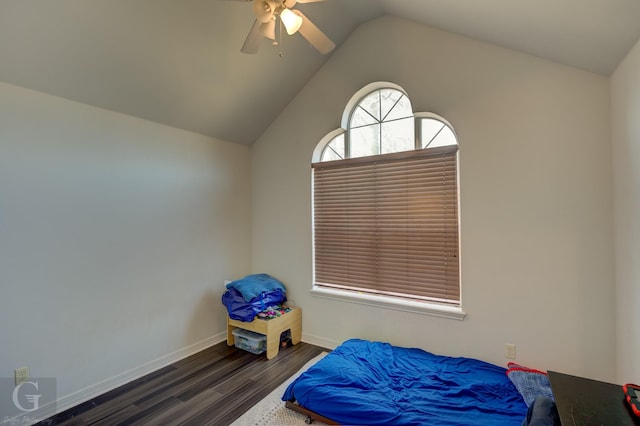 bedroom featuring ceiling fan, lofted ceiling, and dark hardwood / wood-style flooring