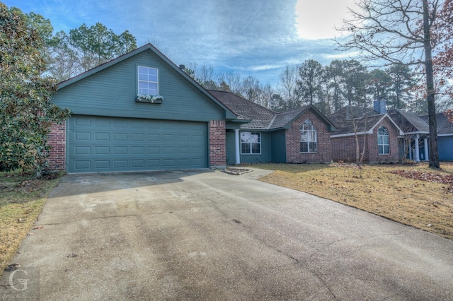 view of front of home featuring a garage and a front yard