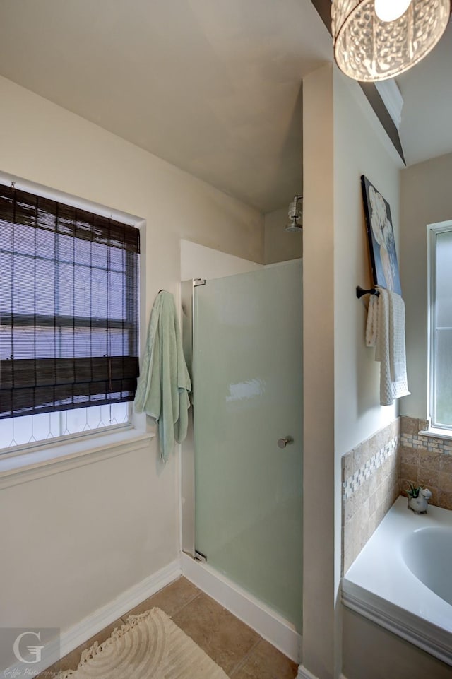 bathroom featuring independent shower and bath and tile patterned flooring